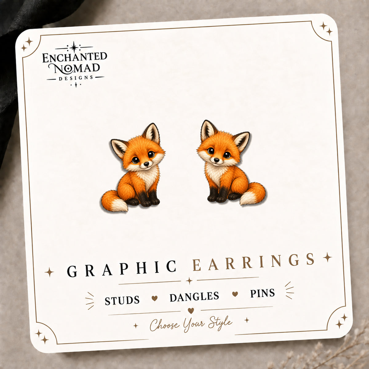 Baby Fox Stud Earrings on the tilted Enchanted Nomad Designs card