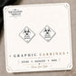 Biohazard Graphic Stud Earrings on the tilted Enchanted Nomad Designs card