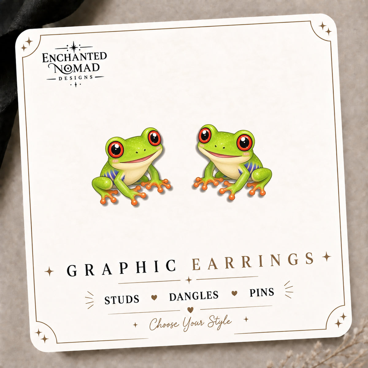 Coquí Frog Earrings & Pins on the tilted Enchanted Nomad Designs card