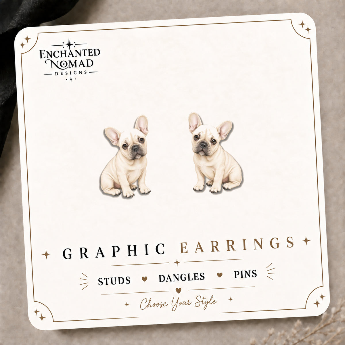 Cream French Bulldog Stud Earrings on the tilted Enchanted Nomad Designs card