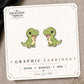 Cute T-Rex Stud Earrings on the tilted Enchanted Nomad Designs card