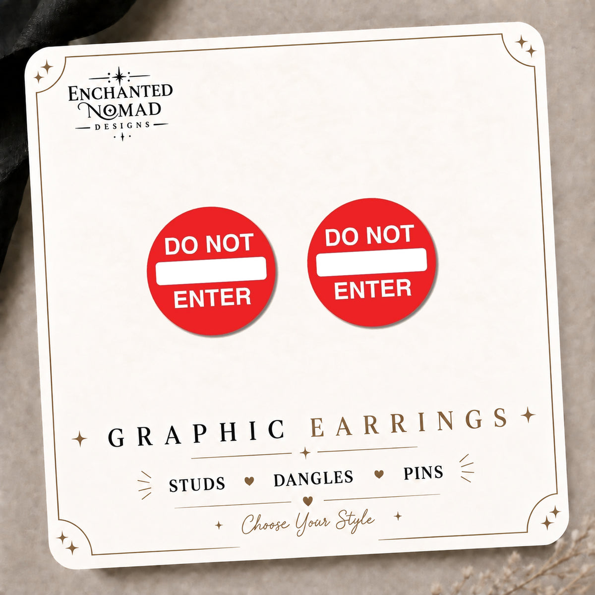 Do Not Enter Sign Stud Earrings on the tilted Enchanted Nomad Designs card