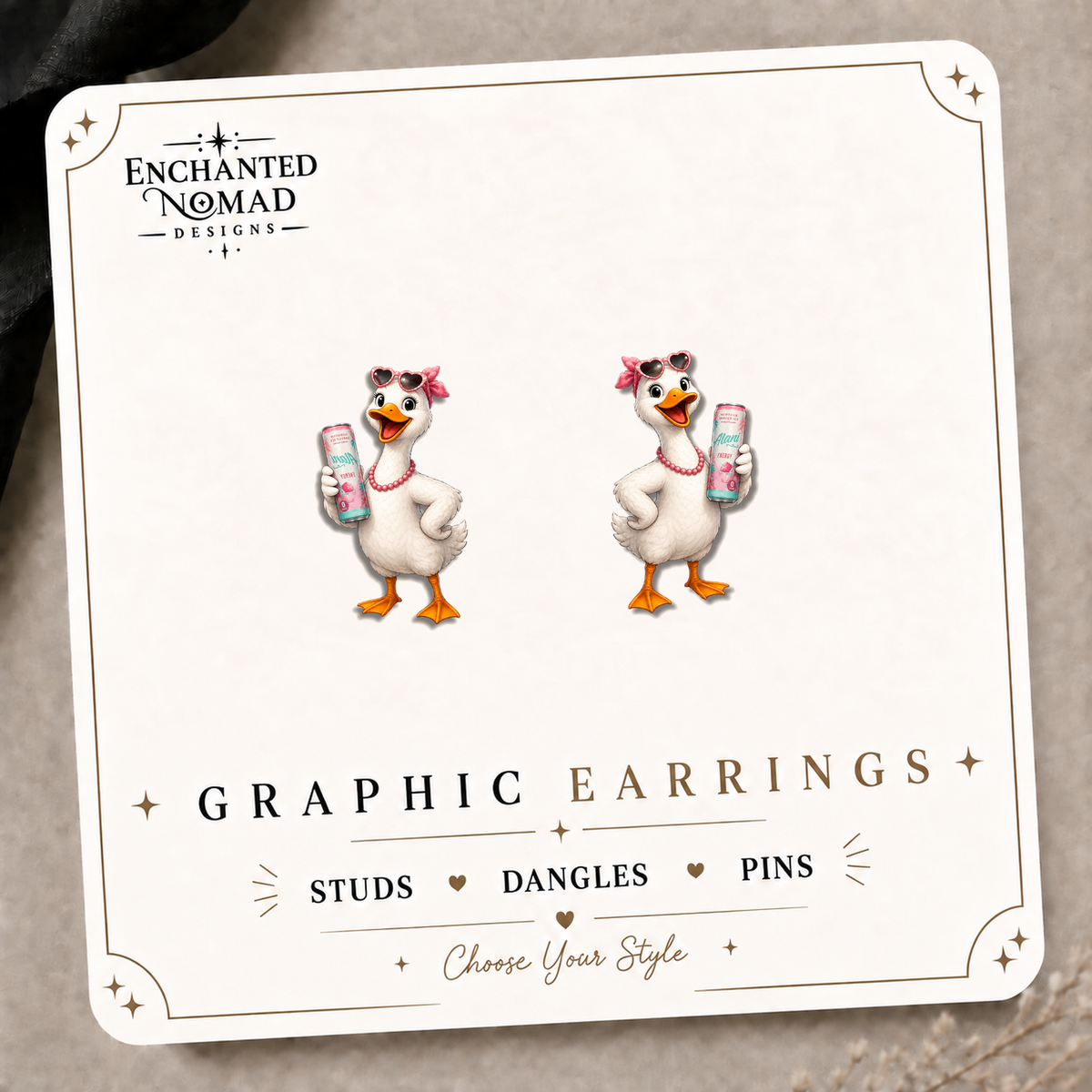 Energy Drink Goose Stud Earrings on the tilted Enchanted Nomad Designs card