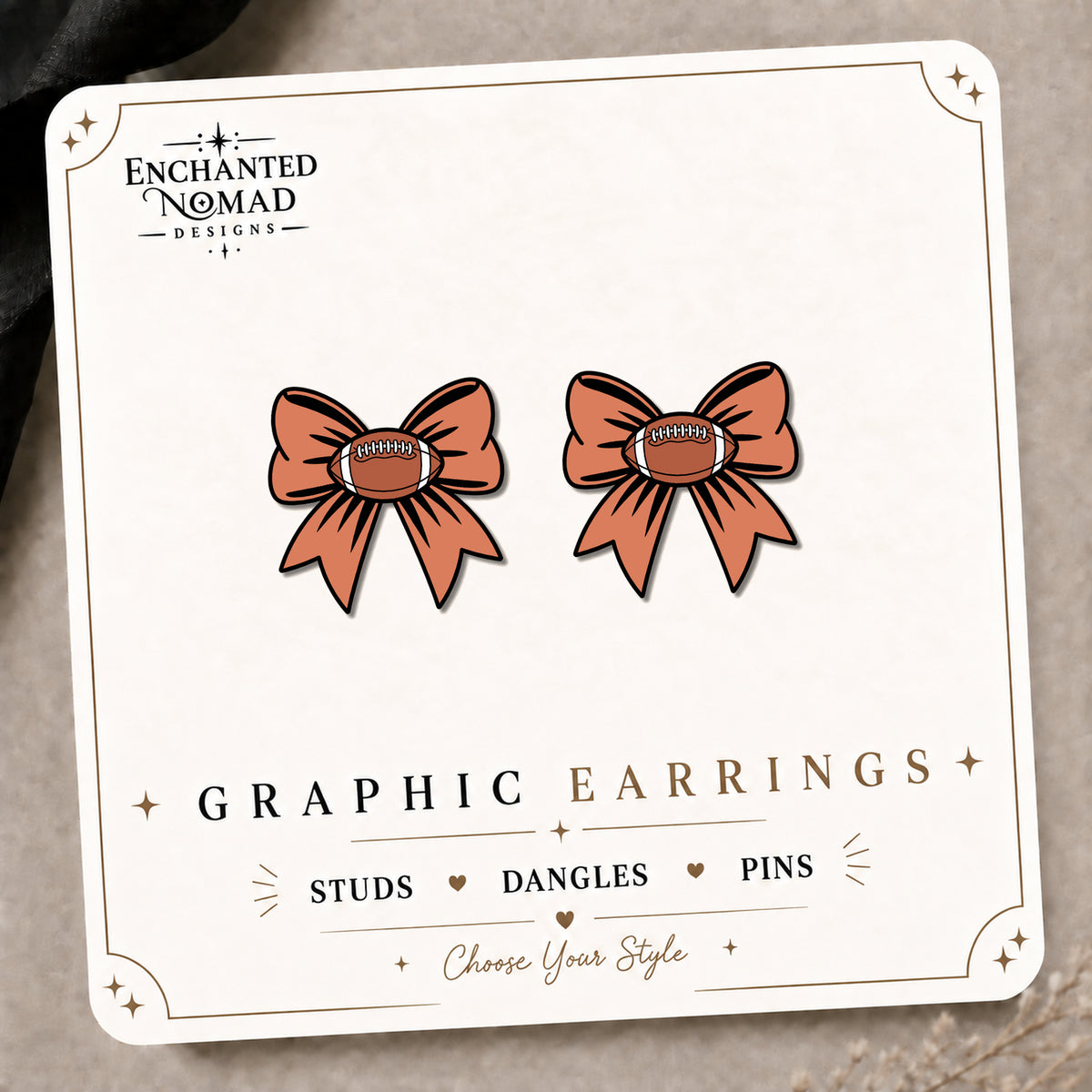 Football Bow Graphic Stud Earrings on the tilted Enchanted Nomad Designs card