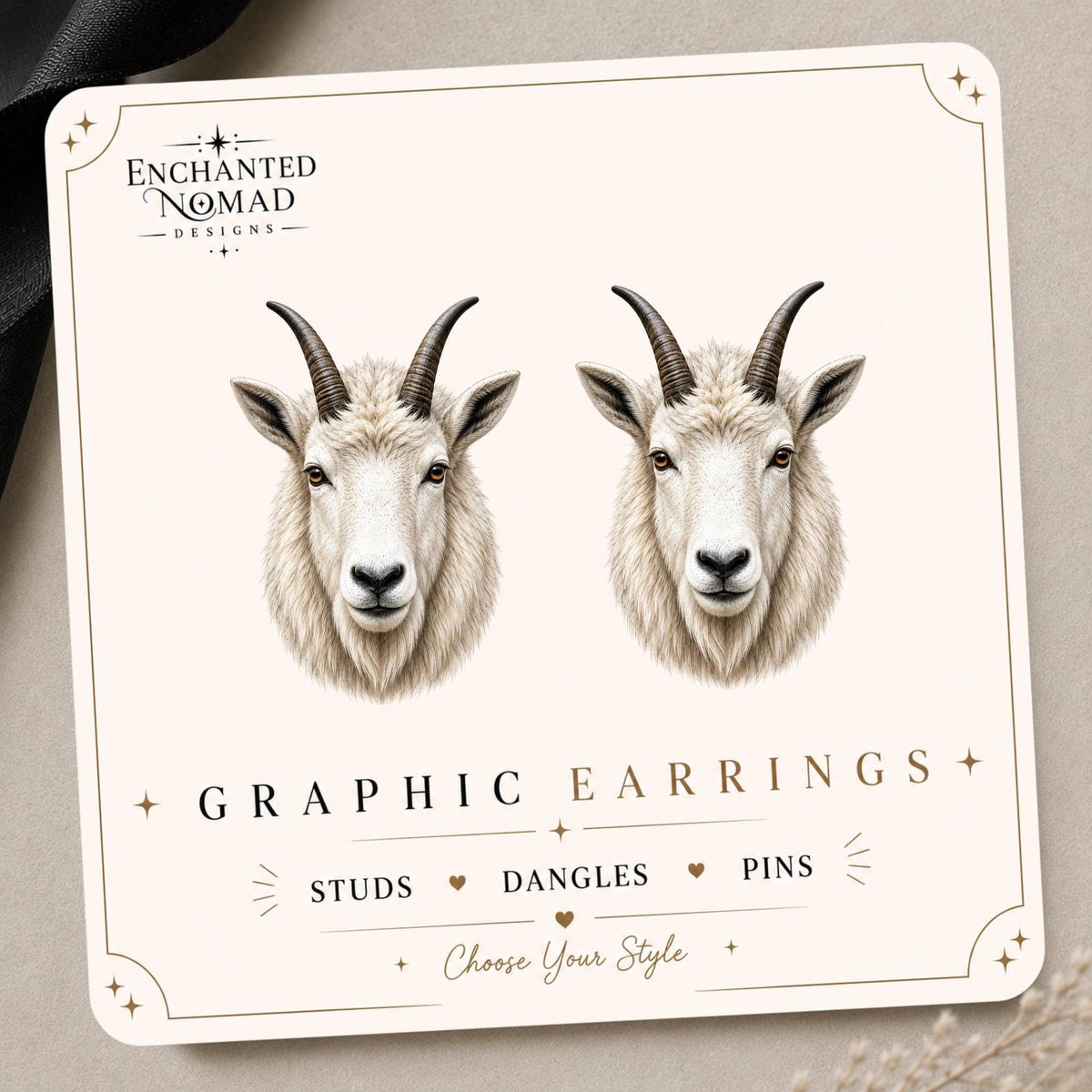 Mountain Goat Earrings & Pins on a branded display card
