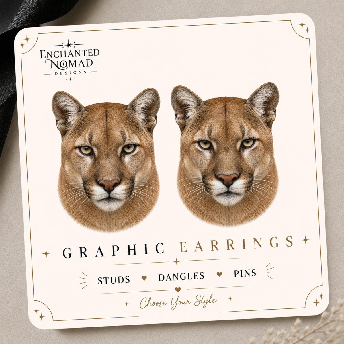 Cougar earrings and pins on a branded display card
