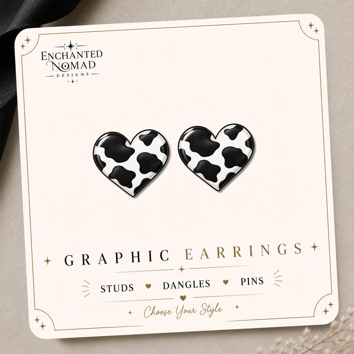 Cow Print Heart Earrings & Pins on a display card