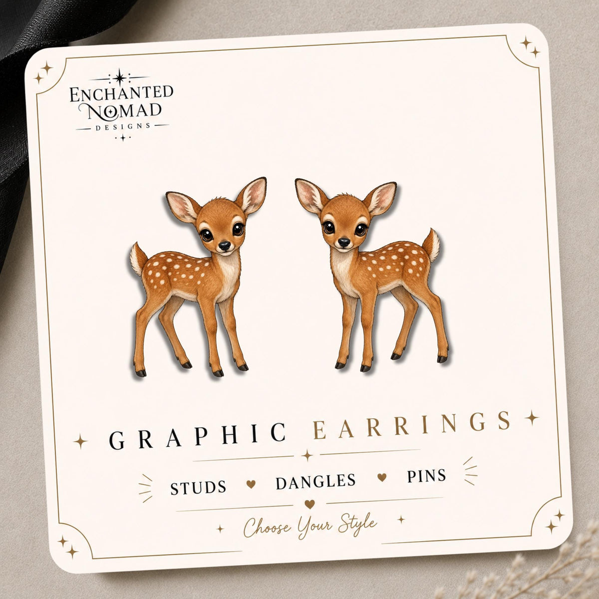 Baby Deer earrings and pins on a branded display card