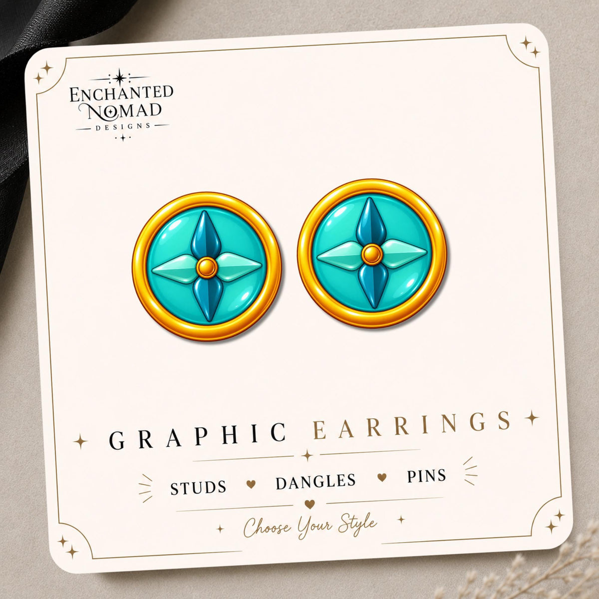 Teal Compass Earrings & Pins on a display card
