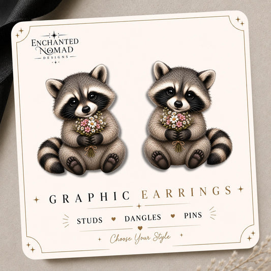 Floral Raccoon earrings on a tilted Enchanted Nomad Designs card