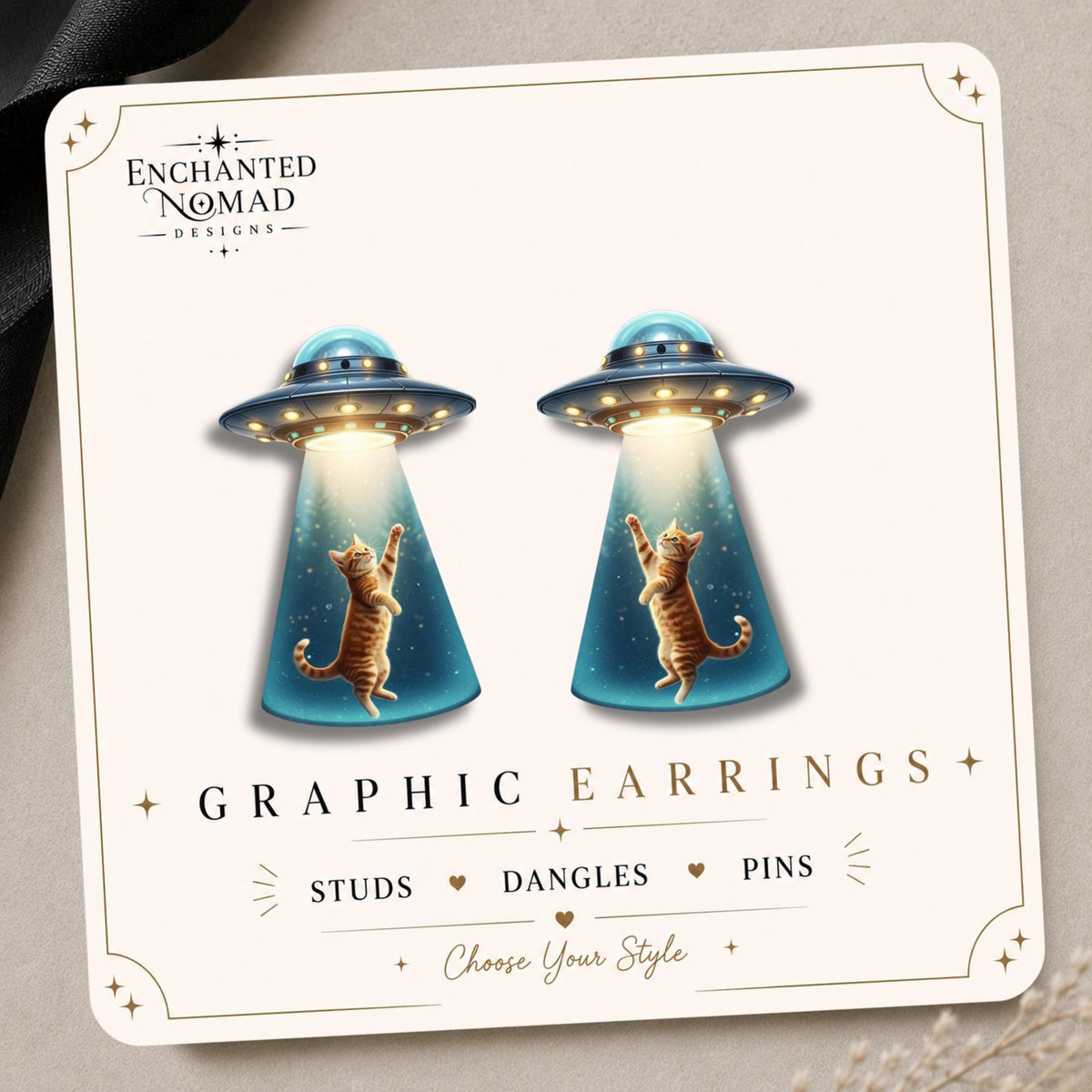 UFO Cat Earrings & Pins on a display card