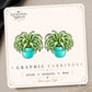 Spider Plant graphic earrings and pins on a display card
