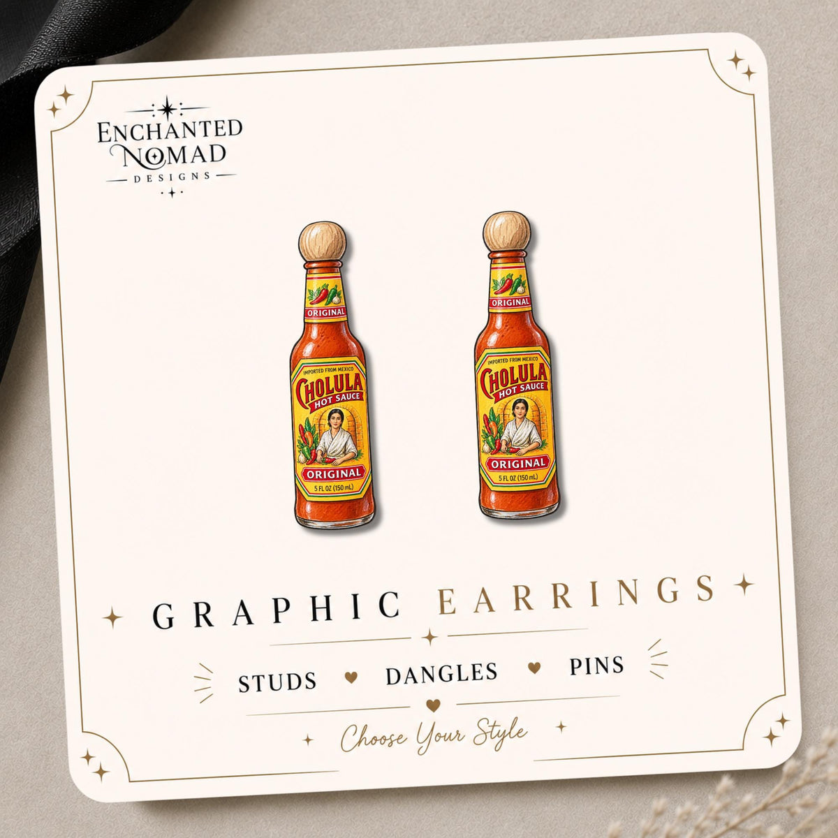 Hot Sauce Bottle Earrings & Pins on a branded display card