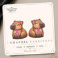 Pink Ribbon Capybara Earrings & Pins on original display card