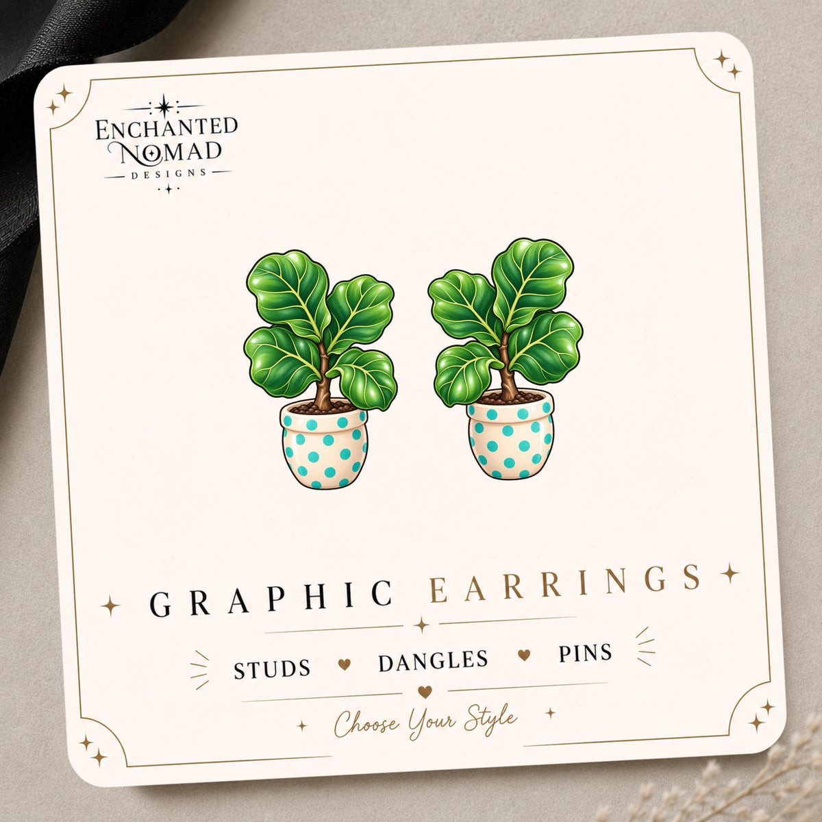 Fiddle Leaf Fig graphic earrings and pins on a display card