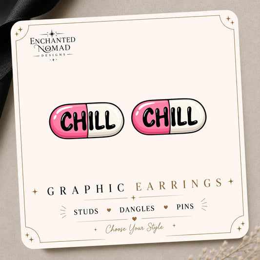 Chill Pill graphic earrings and pins on a display card