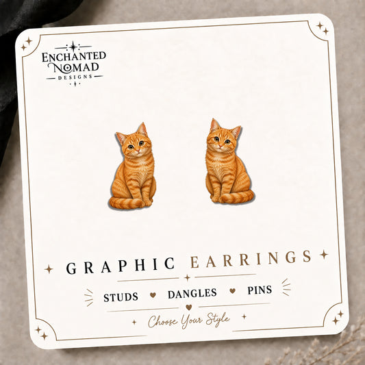 Illustrated Orange Tabby Cat Stud Earrings on the tilted Enchanted Nomad Designs card