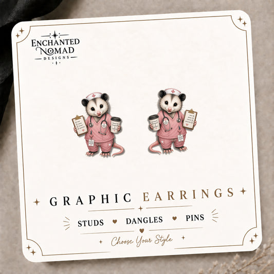 Nurse Opossum Stud Earrings on the tilted Enchanted Nomad Designs card