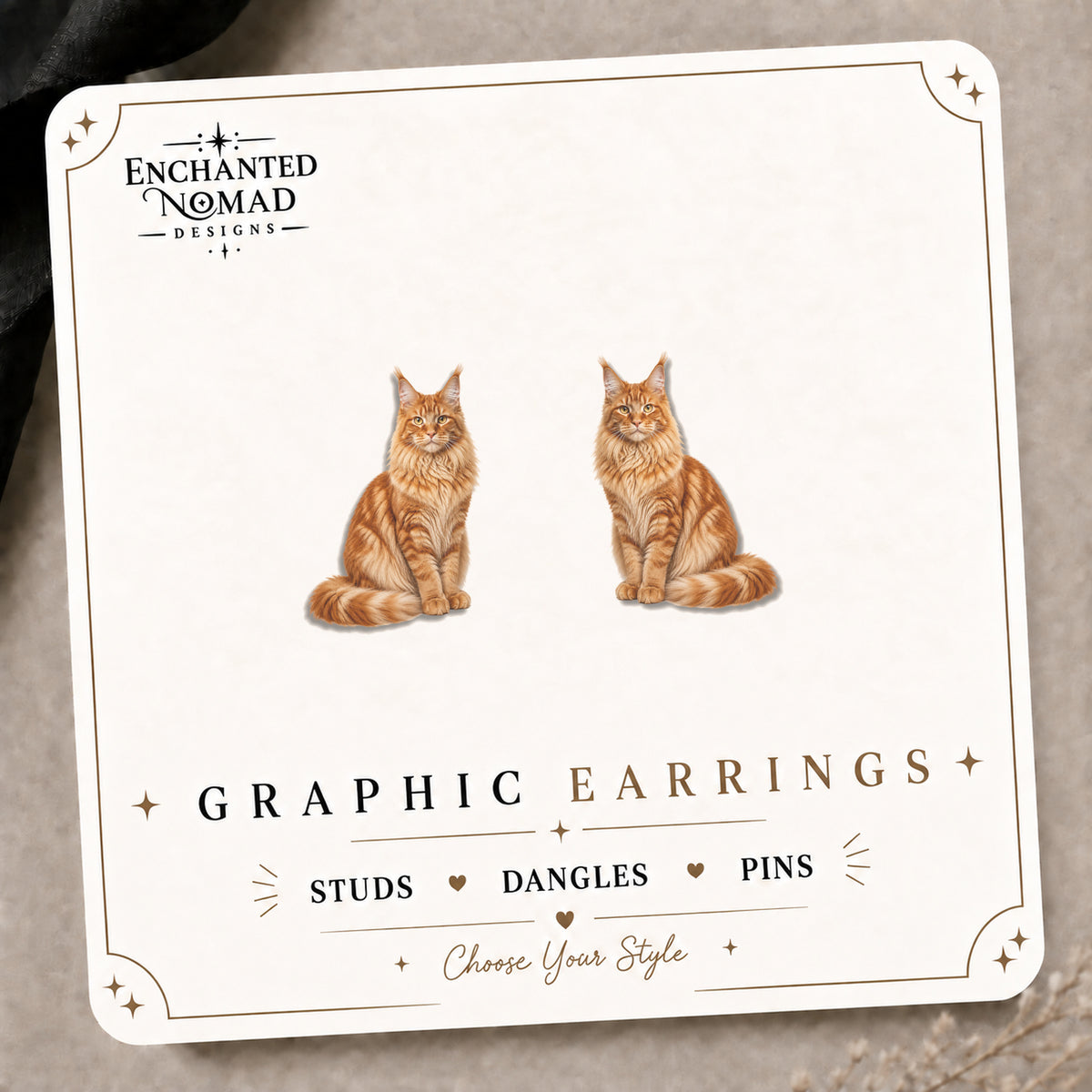 Orange Maine Coon Cat Stud Earrings on the tilted Enchanted Nomad Designs card