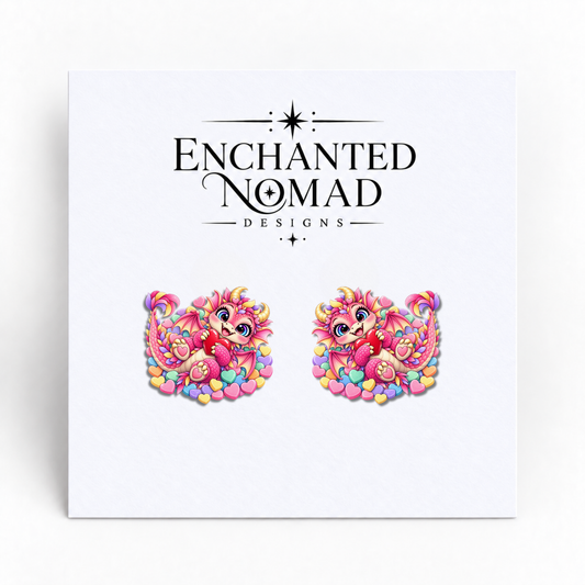 Pink Heart Dragon graphic earrings on display card