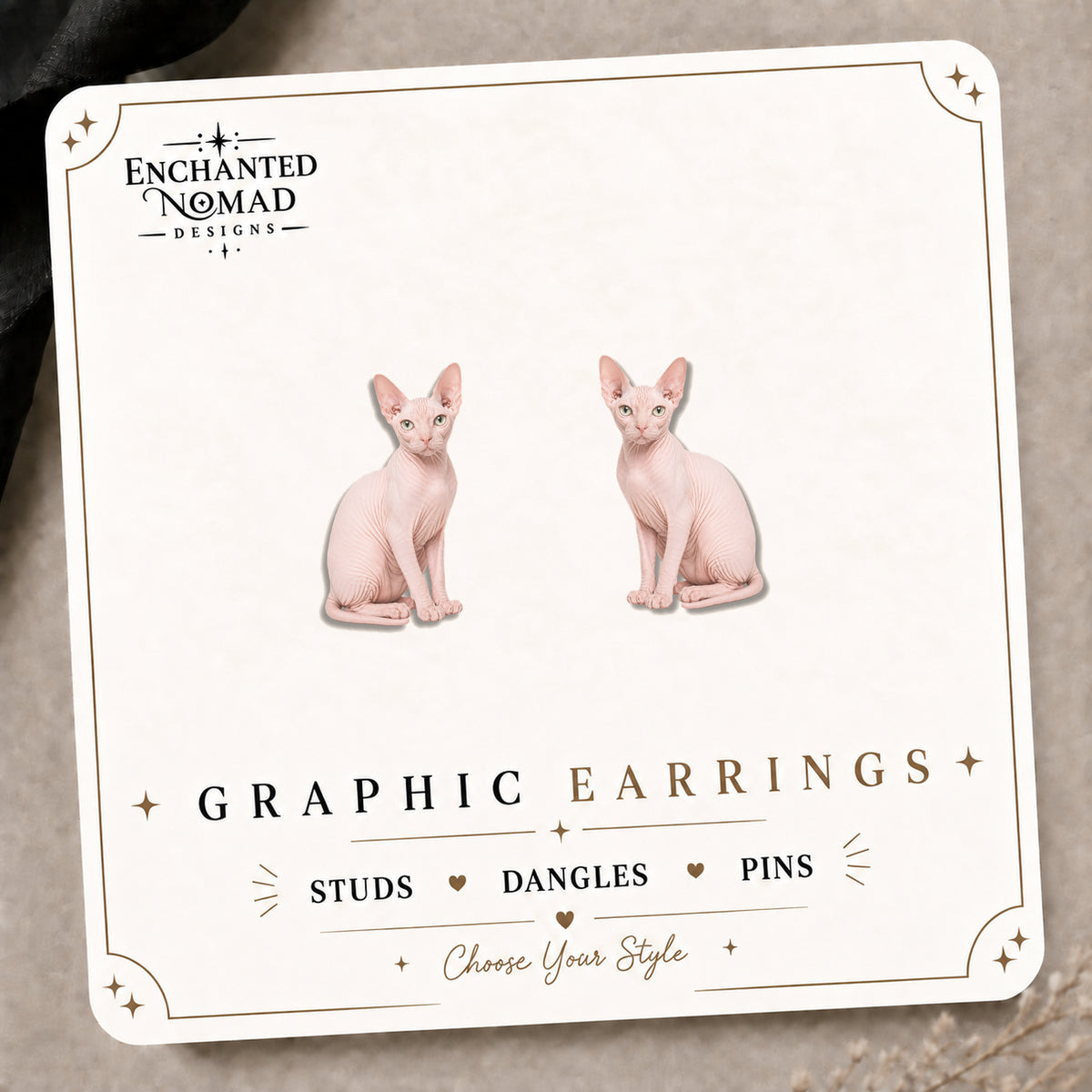 Pink Sphynx Cat Stud Earrings on the tilted Enchanted Nomad Designs card