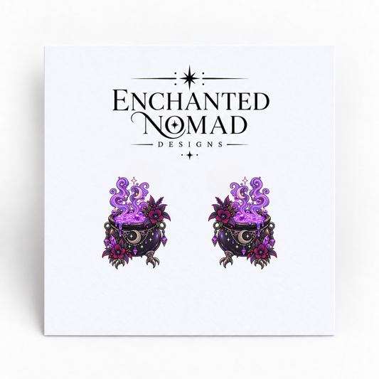 Purple Potion Cauldron graphic earrings on display card