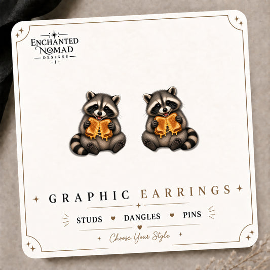 Raccoon Grilled Cheese Stud Earrings on the tilted Enchanted Nomad Designs card