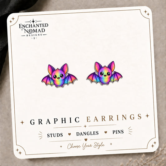 Rainbow Bat Earrings & Pins on the tilted Enchanted Nomad Designs card