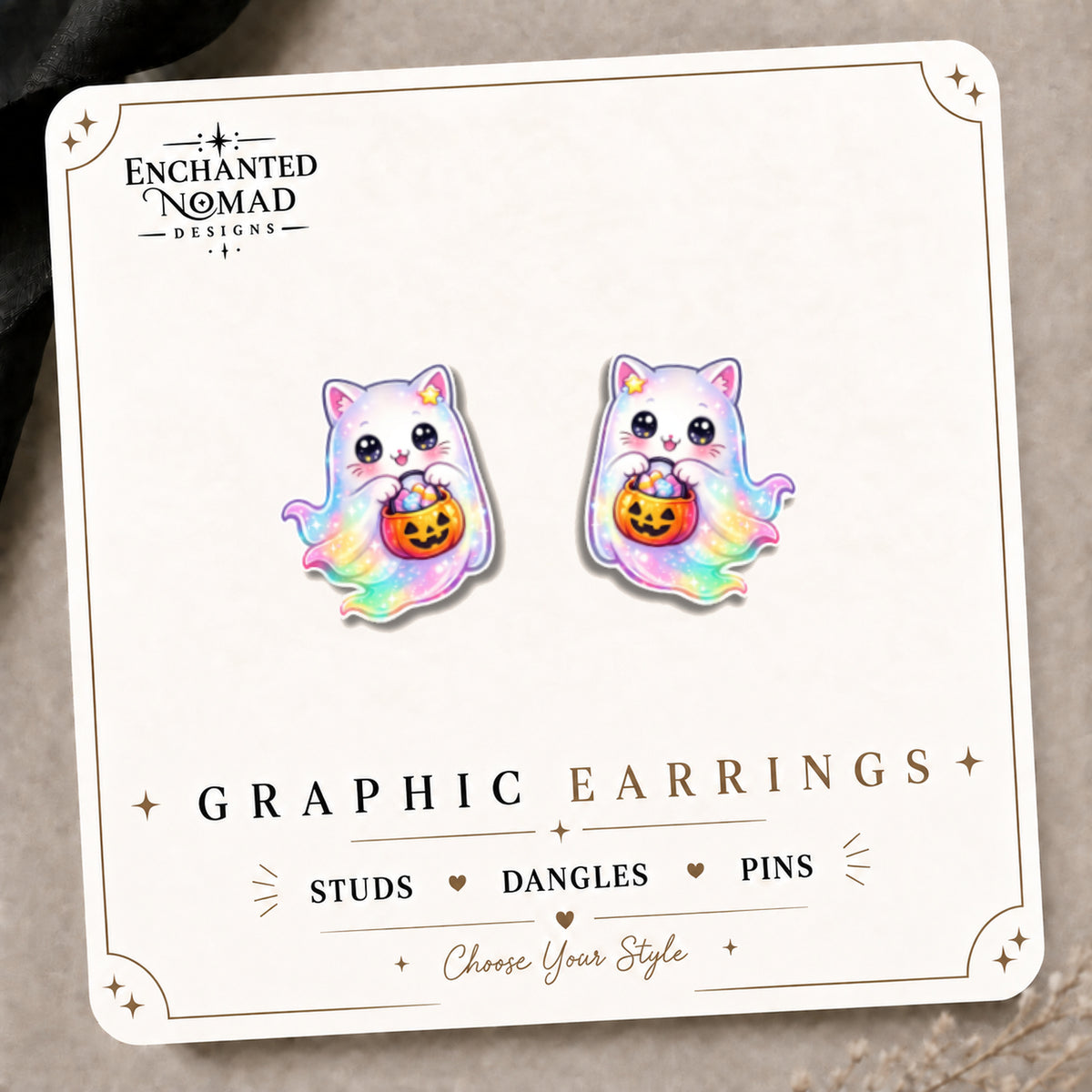 Rainbow Ghost Cat Stud Earrings on the tilted Enchanted Nomad Designs card