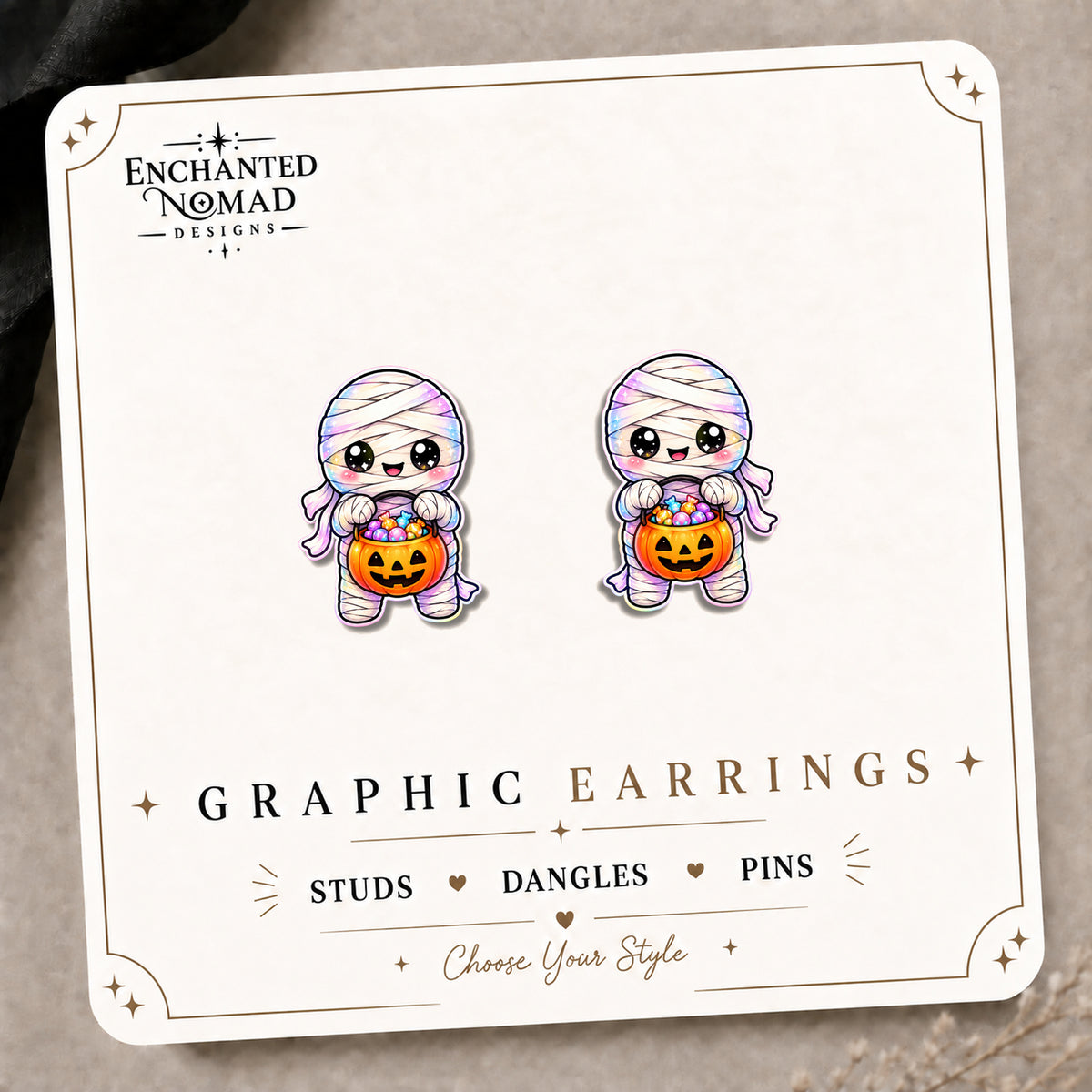 Rainbow Mummy Stud Earrings on the tilted Enchanted Nomad Designs card