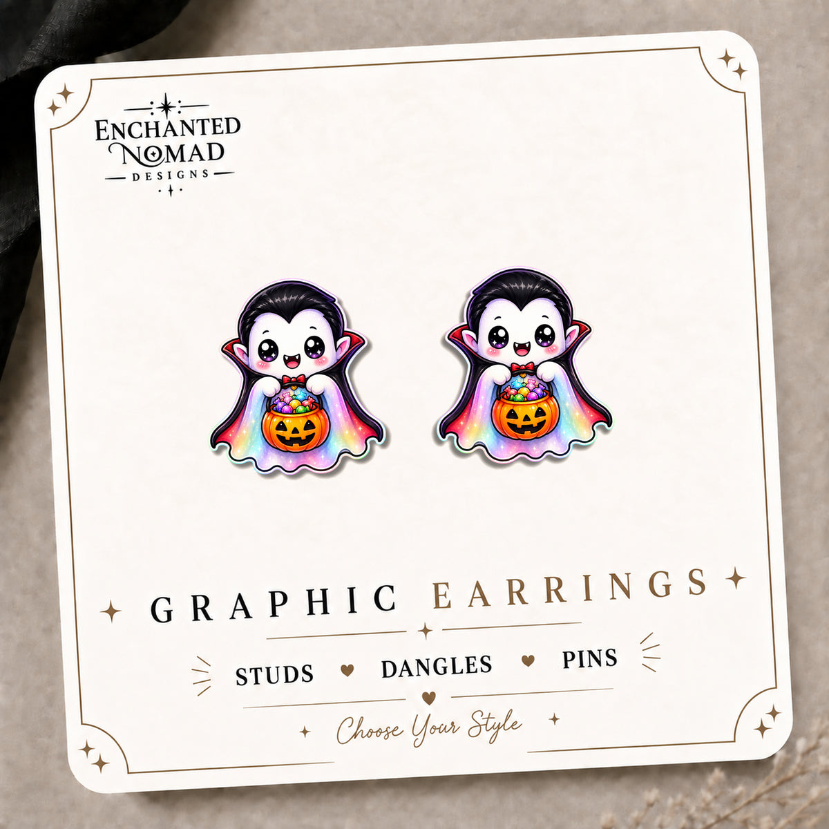 Rainbow Vampire Stud Earrings on the tilted Enchanted Nomad Designs card
