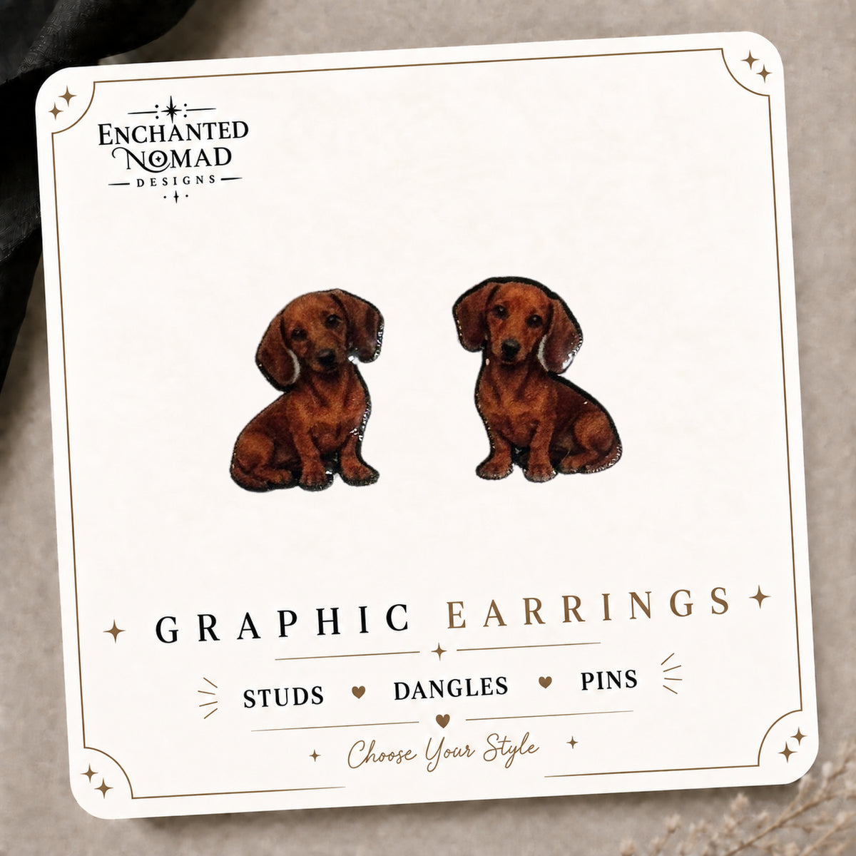 Red Dachshund Stud Earrings on the tilted Enchanted Nomad Designs card