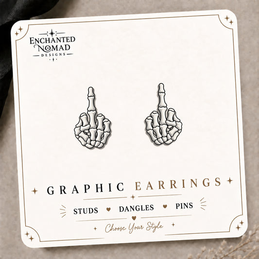 Skeleton Middle Finger Stud Earrings on the tilted Enchanted Nomad Designs card