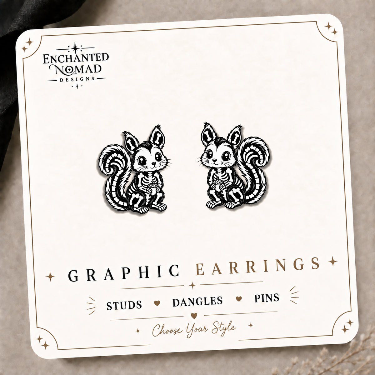 Skeleton Squirrel Stud Earrings on the tilted Enchanted Nomad Designs card