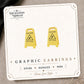 Wet Floor Caution Sign Stud Earrings on the tilted Enchanted Nomad Designs card