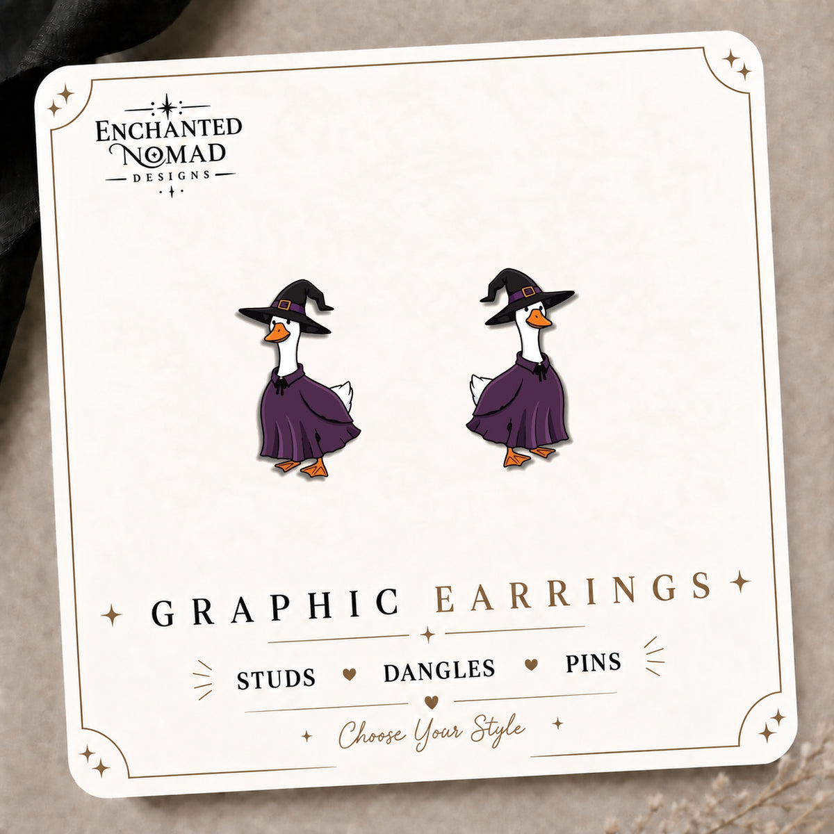 Witch Goose Stud Earrings on the tilted Enchanted Nomad Designs card